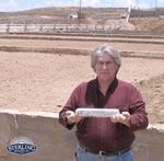Raymond De Motte holding first silver dore bar from Baroness Silver Project during Sterling Mining operations